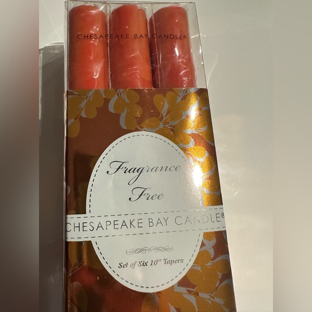 set of 6 orange candles. Unscented 10” tapers